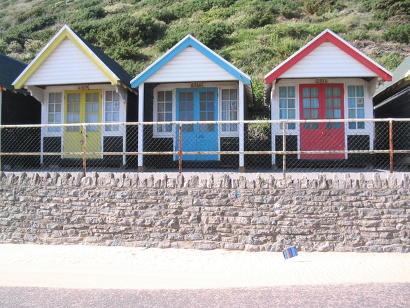 Beach huts in yellow blue and red